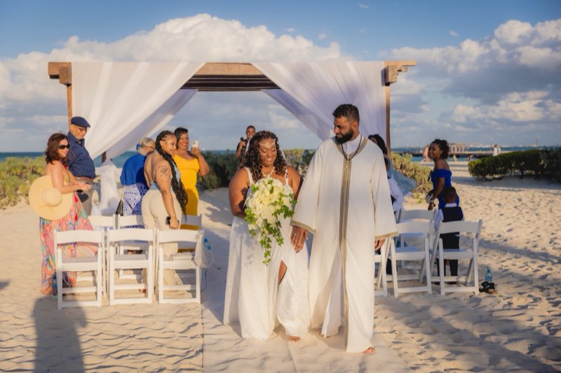 Custom wedding robes at a beach ceremony