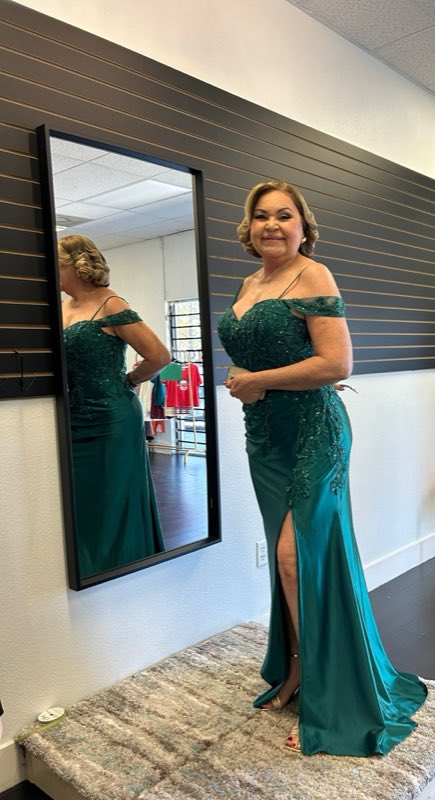 Green gown fitting in the shop